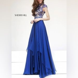 Blue formal evening gown. Satin with beads on top. Cut out back. Size 6.